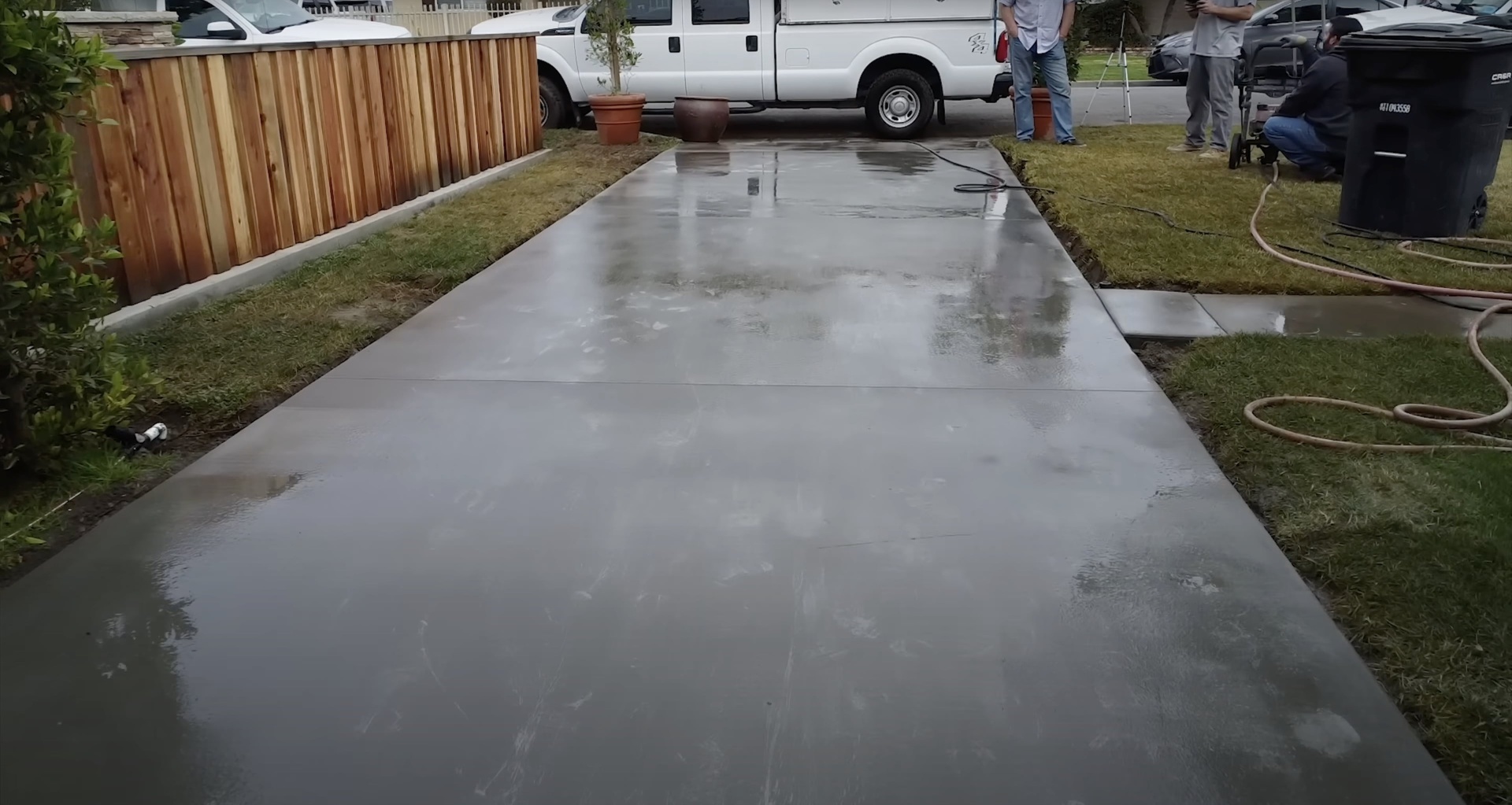 Premium Concrete Driveway - Smooth, durable surface with professional finish Newly completed smooth concrete driveway with professional finish showcasing quality concrete construction