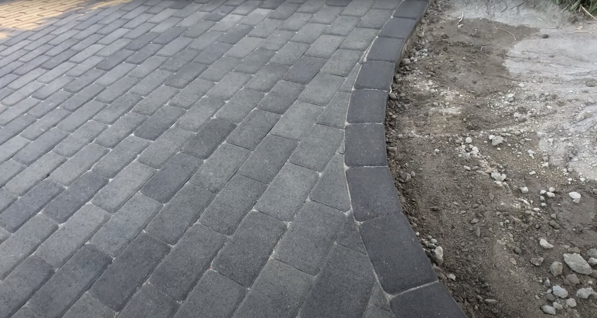 Decorative Concrete Pavers - Interlocking design with precise geometric patterns High-quality interlocking concrete paver installation with precise geometric pattern and professional craftsmanship